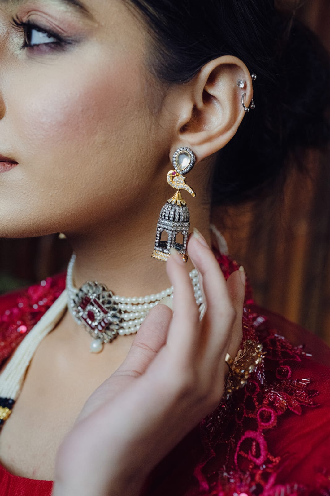 Woman styling the earrings