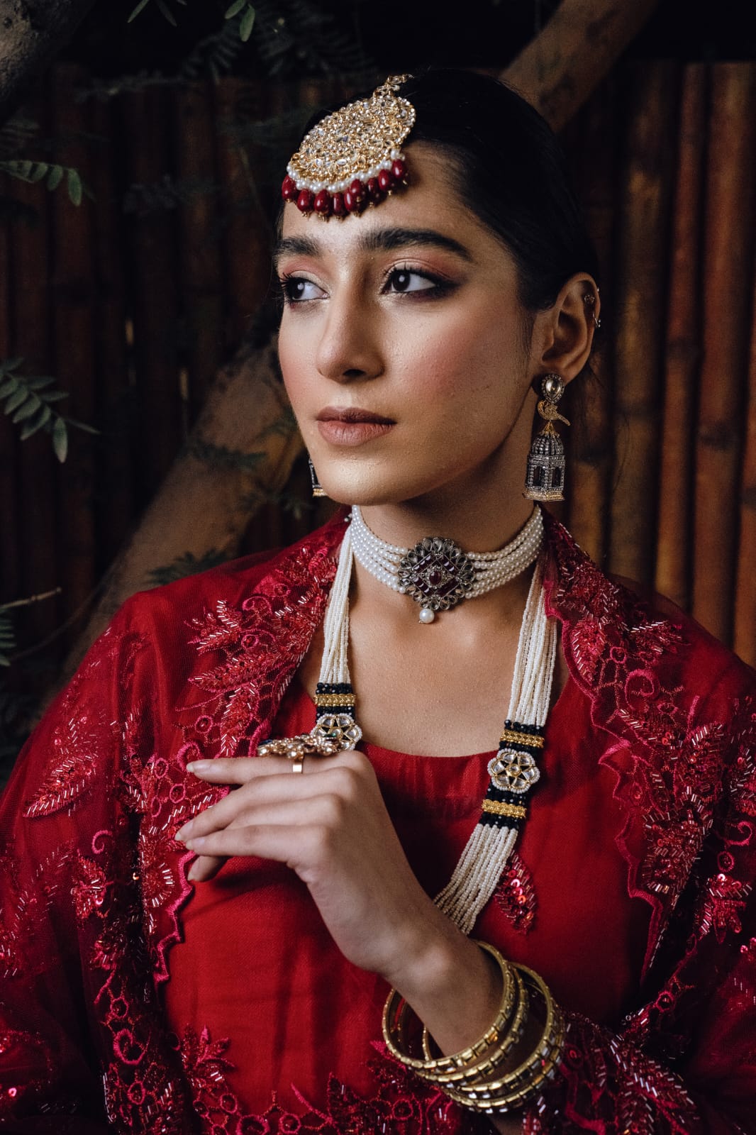 Embark on a mesmerizing voyage through time with the “Qasar-e-Noor Collection ’24.” This collection seamlessly fuses the opulent allure of the Mughal era with a contemporary twist, presenting creations that epitomize both enduring classicism and modern sophistication. With utmost precision and care, each piece encapsulates a narrative steeped in rich heritage, resonating with the lavish opulence that once graced the illustrious courts of ancient India. Immerse yourself in this enchanting fusion of history and refinement, where every jewel narrates a tale of unparalleled beauty and artistry.